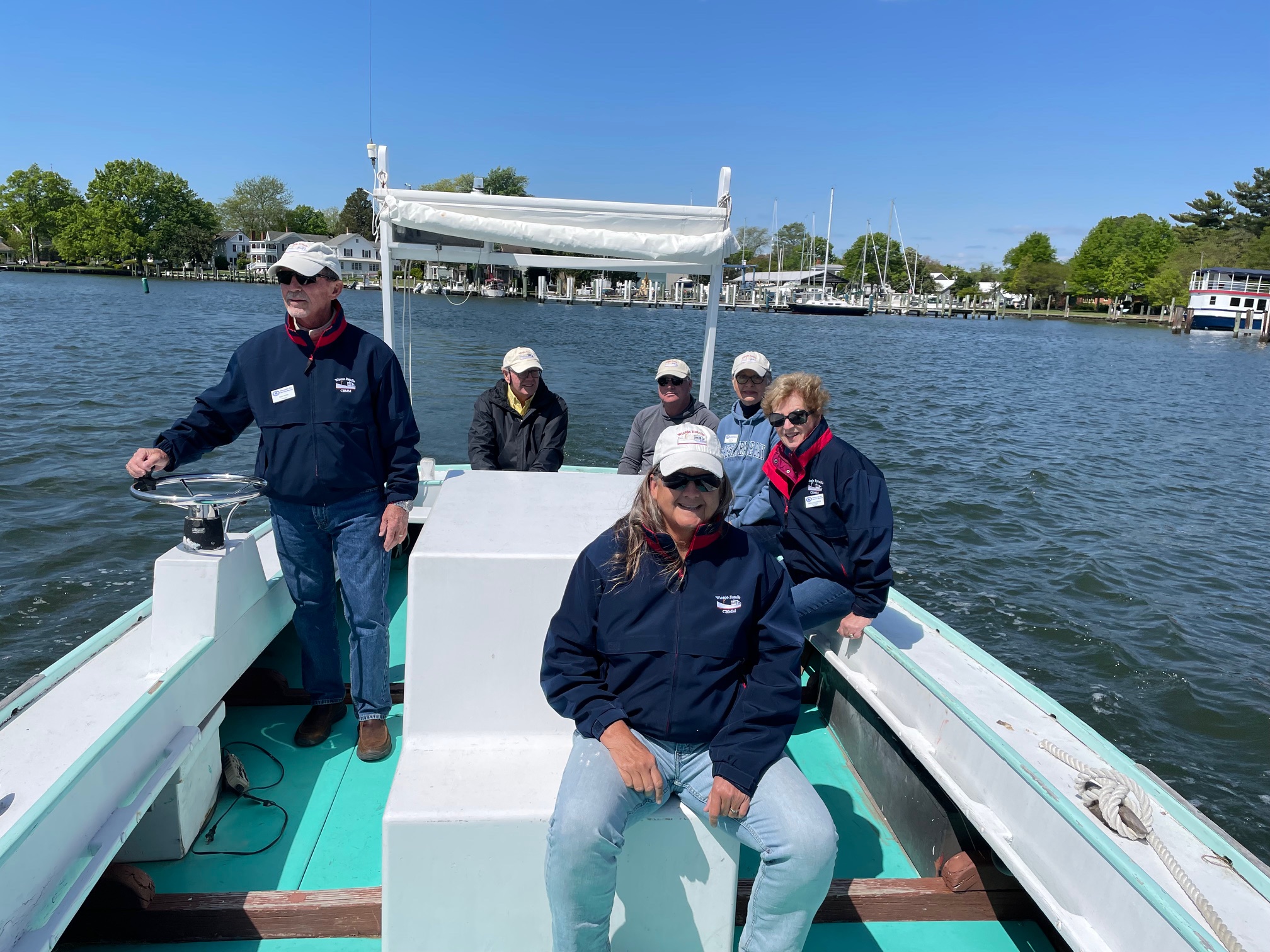 CBMM volunteers navigate the Smith Island crab scrape Volunteer.