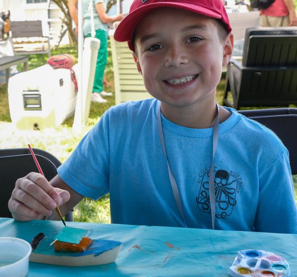 Children can build and paint their own boat next to the Bay History building on Saturday and Sunday. (Photo by George Sass)