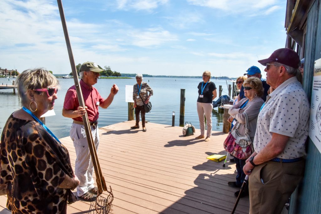 A CBMM interpreter shares a story with guests at Waterman's Wharf.